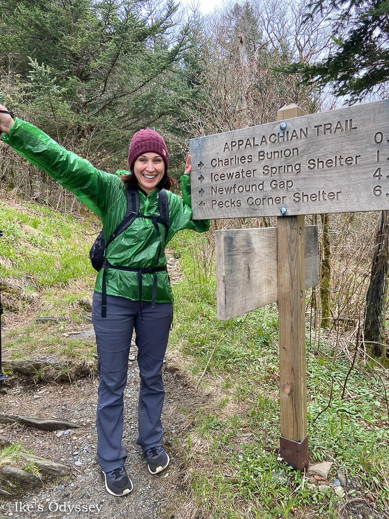 Standing by a trail sign on the Appalachian trail in the Smoky Mountains